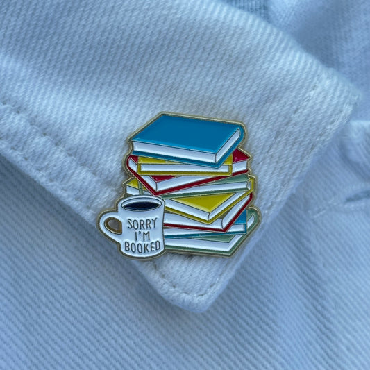 Pin “Sorry, I’m booked” (Cup & Book Stack)