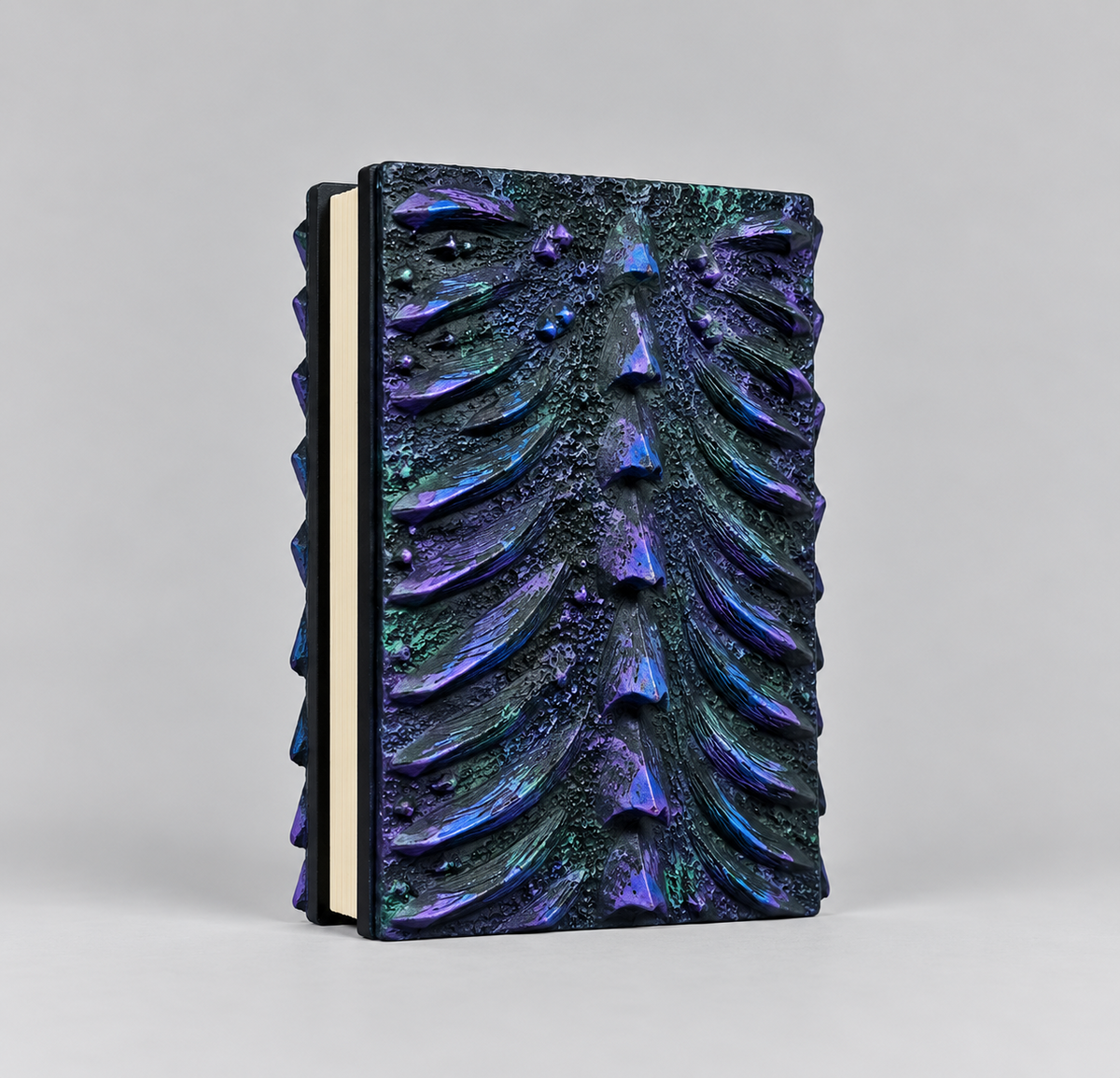 Back cover of the purple dragon journal with a sculpted resin dragon spine