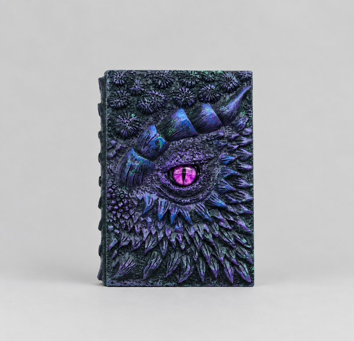 Purple embossed dragon notebook standing upright, fantasy DnD journal