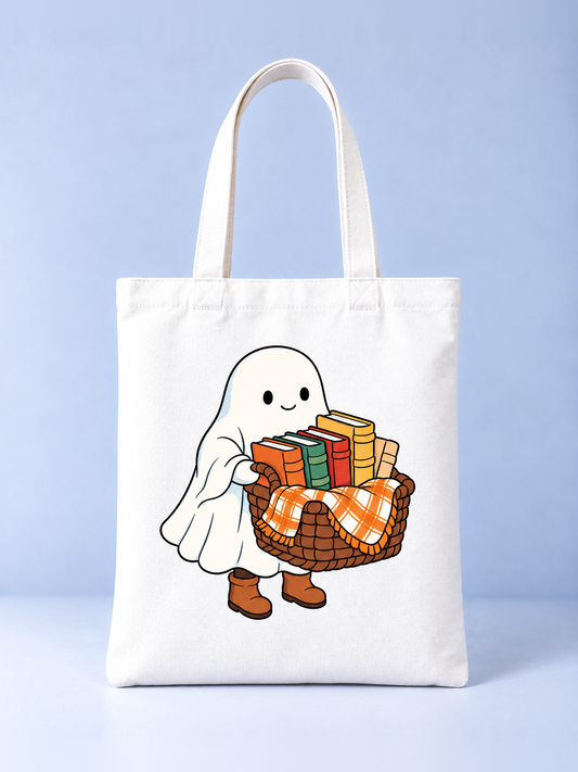 Ghost with a Basket of Books Halloween tote bag, front view – cream canvas tote with a ghost in boots carrying a basket of books and plaid blanket print