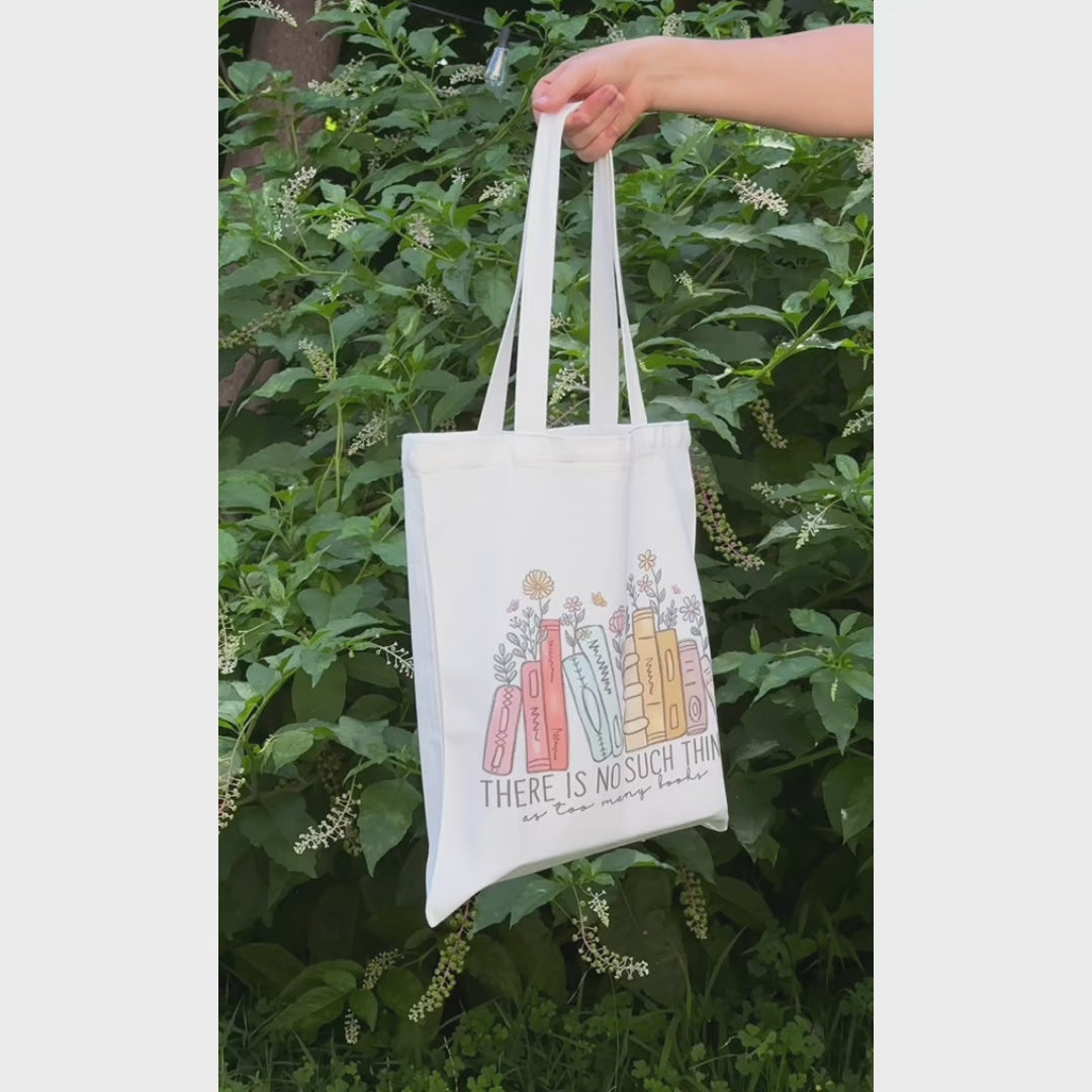 Reusable cotton tote bag with the quote “There is no such thing as too many books” — ideal for book lovers, readers, and bookworms